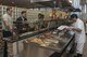 U.S. Air Force Airmen wait for their food in the Falcon Feeder at Misawa Air Base, Japan, July 18, 2017. The Falcon Feeder adjusts their schedule for instances like surge weeks, which is an increased operations tempo, in order to accommodate flightline personnel and their shifts. (U.S. Air Force photo by Airman 1st Class Sadie Colbert)