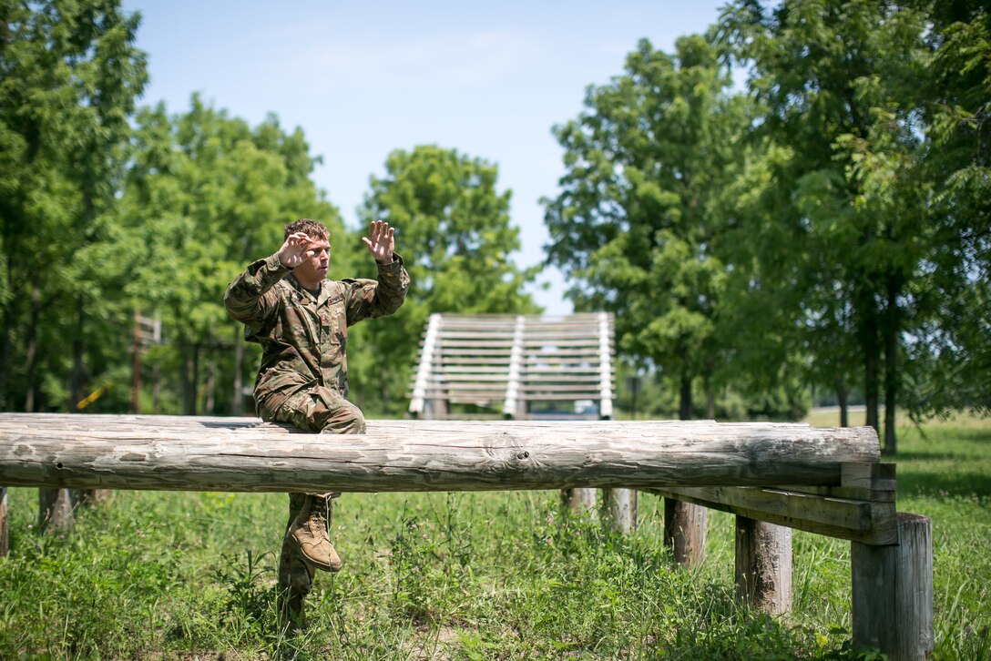 Army Pfc. Robert Nelson negotiates a high step obstacle at Camp Atterbury, Ind., July 17, 2017, during the 2017 Army Materiel Command's Best Warrior Competition. Nelson is assigned to the 687th Rapid Port Opening Element. Army photo by Sgt. 1st Class Teddy Wade