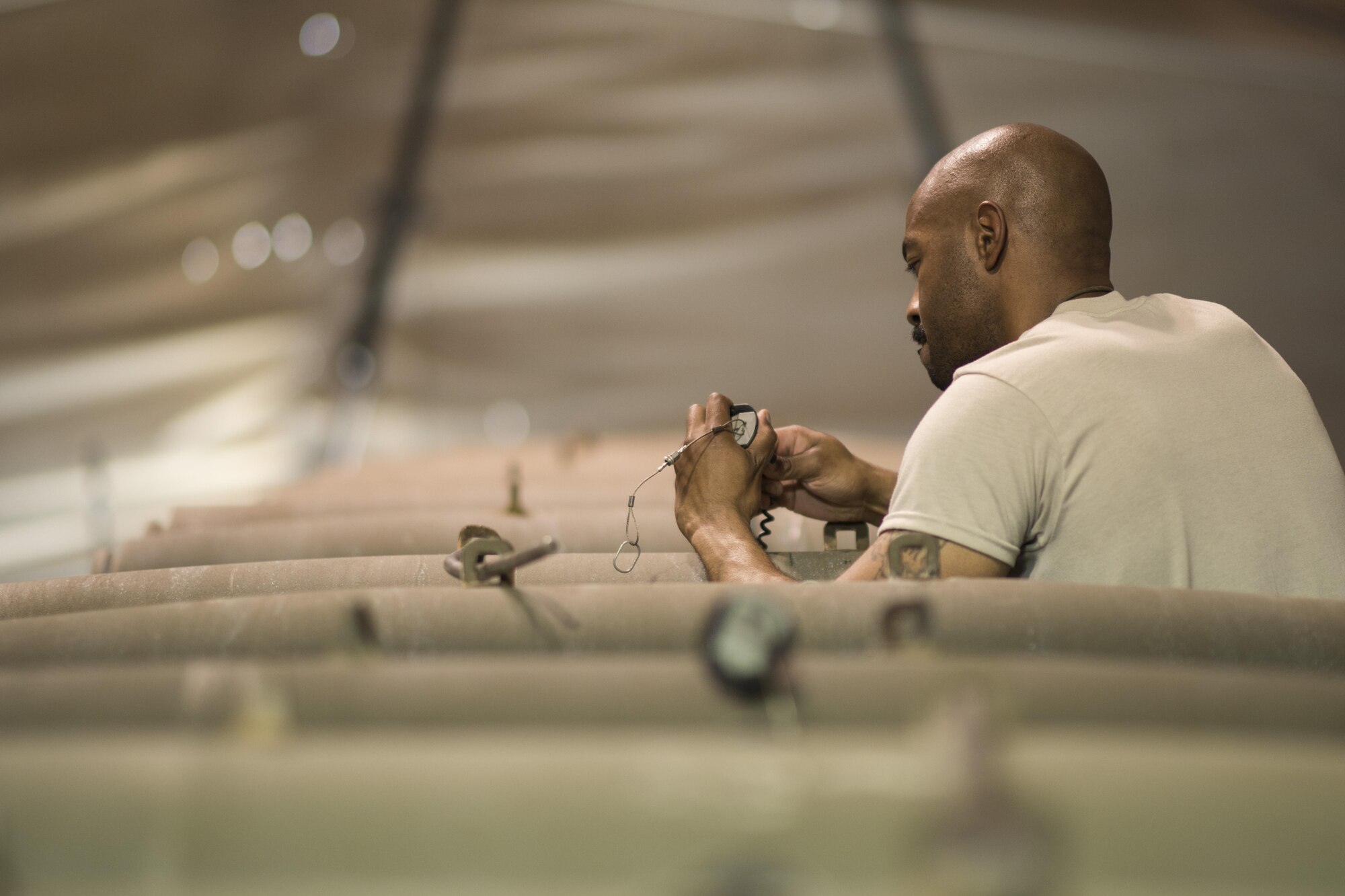 Master Sgt. Jevon Boutte, 332nd Expeditionary Maintenance Squadron production section chief, fuses a GBU-12 laser-guided bomb July 7, 2017, in Southwest Asia. The bombs will be mounted on an F-15E-Strike Eagle in support of Operation Inherent Resolve. (U.S. Air Force photo/Senior Airman Damon Kasberg)