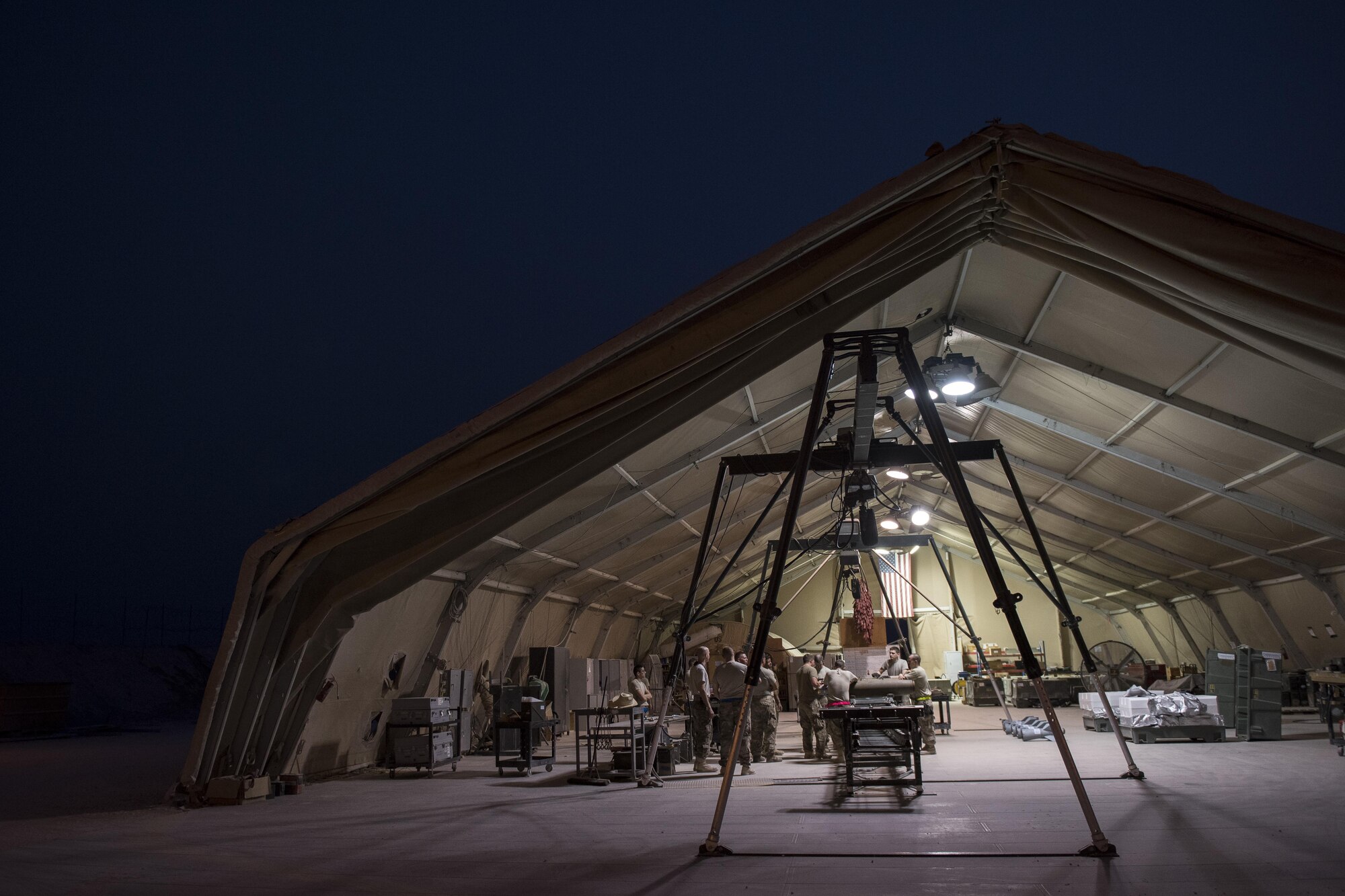 Airmen from the 332nd Expeditionary Maintenance Squadron build GBU-38s, July 12, 2017, in Southwest Asia. The squadron builds and maintains a variety of munitions to arm F-15E Strike Eagles and MQ-9 Reapers in support of Operation Inherent Resolve. (U.S. Air Force photo/Senior Airman Damon Kasberg)