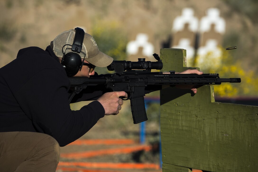 U.S. Marine Corps Capt. William Cunningham, the officer in charge of the Marine Corps Action Shooting Team, engages steel targets from behind cover during the Superstition Mountain Mystery 3-Gun Competition at Mesa, Ariz., March 24, 2017. 3-Gun is a discipline where competitors engage targets in unique scenarios using rifles, shotguns, and pistols or any combination of the three. The Marine Corps Action Shooting Team, based out of Marine Corps Base Quantico, Va., competes in competitions throughout the U.S. and abroad. (U.S. Marine Corps photo taken by Lance Cpl. Christian Cachola)