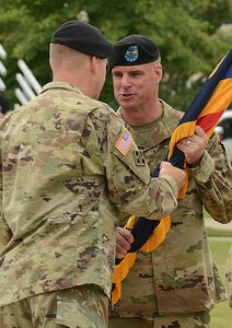 (From right) U.S. Army Maj. Gen. Malcolm Frost accepts the U.S. Army Center for Initial Military Training colors from Gen. David Perkins, U.S. Army Training and Doctrine Command commanding general, symbolizing his assumption of leadership during a change of command ceremony at Joint Base Langley-Eustis, Va., July 18, 2017. Frost also assumed responsibilities as JBLE and Joint Expeditionary Base Little Creek- Fort Story, Va., Army Element senior commander. He formerly served as the Chief of Public Affairs at the Office of the Secretary of the Army. (U.S. Air Force photo/Staff Sgt. Teresa J. Cleveland)