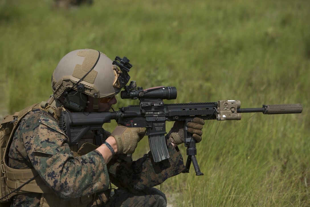 A U.S. Marine with 1st Battalion, 6th Marine Regiment, 2nd Marine Division (2d MARDIV), aims down range utilizing his Sea Dragon 2025 weapon systems and gear during a live-fire range at Range G-6, Camp Lejeune, N.C., July 12, 2017. The Sea Dragon 2025 equipment showcased new capabilities for Marines to use in future exercises and operations. (U.S. Marine Corps photo by Lance Cpl. Justin X. Toledo)