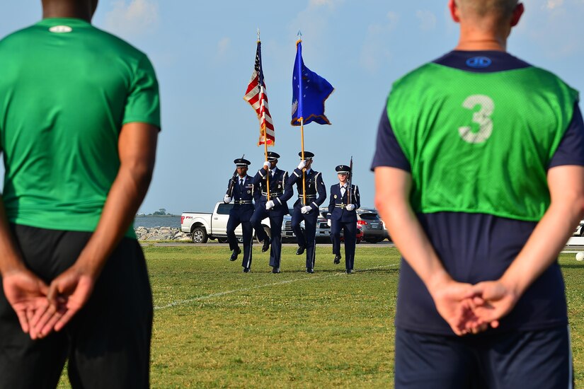 Langley Air Force Base Honor Guard members post the colors during the Intramural Soccer Championship at Joint Base Langley-Eustis, Va., July 12, 2017. The season consisted of 13 total games with 10 regular games, two playoff games and the final championship. (U.S. Air Force photo/ Airman Alexandra Naranjo)