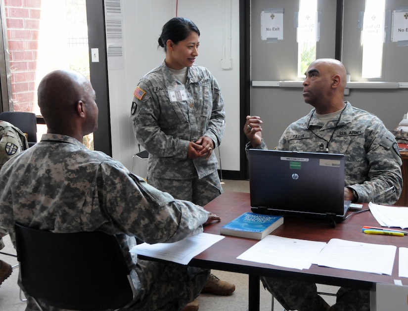 Sgt. 1st Class Luis Pagan, a practical nursing specialist (far right) assigned to Army Medical Department Professional Management Command (APMC), and Maj. Ausha Partido, the mobilization officer for Western Medical Area Readiness Support Group (middle), are assisting U.S. Army Reserve Soldiers assigned to the 7452nd Medical Backfill Battalion who have been identified to prepare for a Professional Filler System (PROFIS) mission.   Soldiers mobilized to support this mission will backfill Medical Command’s active duty slots at medical centers and clinics across their health care organization.  APMC hosted the Soldier Readiness Processing (SRP) level 2 from 7-9 Jul., processing approximately 100 U.S. Army Reserve Soldiers from the 7452nd MBB during the 3-day event. The objective of the process is for Soldiers to be administratively, financially, legally, spiritually, logistically and medically ready to be mobilized after attending an SRP.