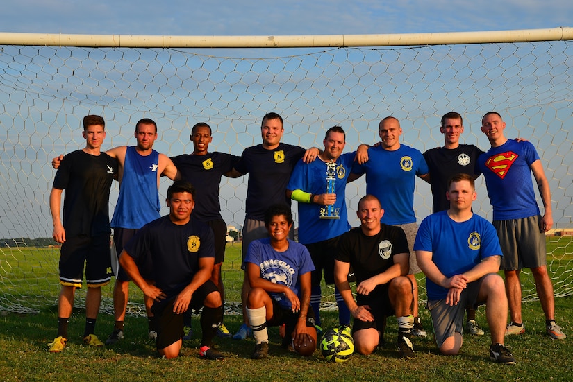 Airmen from the 497th Operations Support Squadron pose for a team photo after winning the Intramural Soccer Championship at Joint Base Langley-Eustis, Va., July 12, 2017. The 497th OSS defeated the 1st OSS 2-1 during the final game. (U.S. Air Force photo/ Airman Alexandra Naranjo)