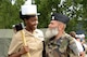 A U.S. Navy Seaman and a member of the Armée de Terre switch hats for a photo at Camp de Satory, France, July 12, 2017. During rehearsals, military members from countries had the opportunity to interact and learn from the other’s military traditions and culture, further strengthening the bond between old allies. (U.S. Air Force photo by Airman 1st Class Savannah L. Waters)
