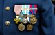 A Bastille Day military parade participant’s medals are displayed on their uniform at Camp de Satory, France, July 12, 2017. U.S. and Armée de Terre military members marched in the Bastille Day military parade at the Avenue des Champs-Élysées, France, on July 14, 2017, to celebrate the French Republic’s National Day. (U.S. Air Force photo by Airman 1st Class Savannah L. Waters)