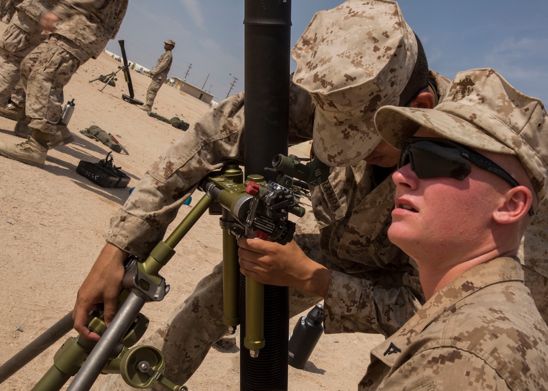 U.S. Marine Corps Private First Class Ricardo Miranda, left, and Lance Cpl. Zach D. Vanderpuyl, mortarmen with 1st Battalion 1st Marine Regiment, Marine Air-Ground Task Force-8 (MAGTF) bisect sights on a M252 81mm mortar system for mortar familiarization training during Integrated Training Exercise (ITX) 5-17 at Marine Corps Air Ground Combat Center, Twentynine Palms, Calif., July 18, 2017. The purpose of ITX is to create a challenging, realistic training environment that produces combat-ready forces capable of operating as an integrated MAGTF. (U.S. Marine Corps Photo by Cpl. Justin M. Smith)