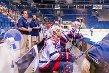 Capt. Derrick Burnett, National Reconnaissance Office, chief of mission operations, looks on during the world championship game at the Ondrej Nepala Arena, Bratislava, Slovakia, July 1, 2017.  Burnett, as a third-year player on the team, monitored the games and provided feedback to his fellow players. (Photo by Jozef Kaffka/StarLine photography) 