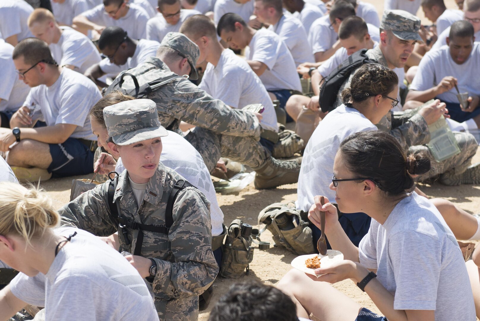 Chaplain candidates have lunch with basic military trainees during a tour of the Basic Expeditionary Airmen Skills Training at Joint Base San Antonio-Lackland, Texas, July 5, 2017. The tour was part of the Chaplain Candidate Intensive Internship. (U.S. Air Force photo by Senior Airman Krystal Wright)