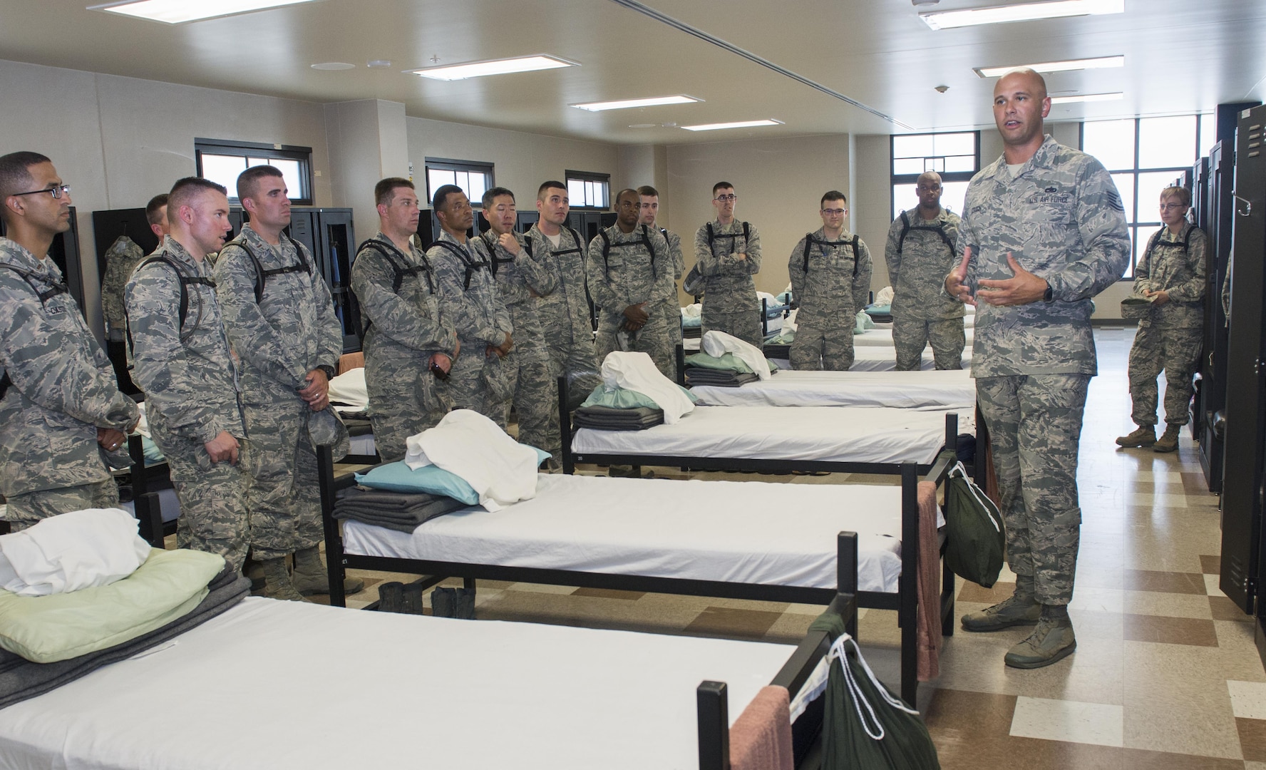 Tech. Sgt. Paul Couch, 323rd Training Squadron military training instructor, provides a tour to chaplain candidates of an Airman Training Complex at Joint Base San Antonio-Lackland, Texas, July 5, 2017. The tour was part of the Chaplain Candidate Intensive Internship. (U.S. Air Force photo by Senior Airman Krystal Wright)