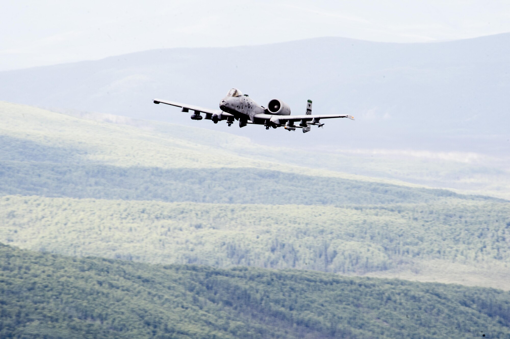 A U.S. Air Force A-10 Thunderbolt aircraft assigned to the 25th Fighter Squadron out of Osan Air Base, South Korea, performs a maneuver in the Joint Pacific Alaska Range Complex June 29, 2017, in Delta Junction, Alaska. The A-10 Thunderbolt II is an accurate and survivable weapons-delivery platform. (U.S. Air Force photo by Airman 1st Class Isaac Johnson)
