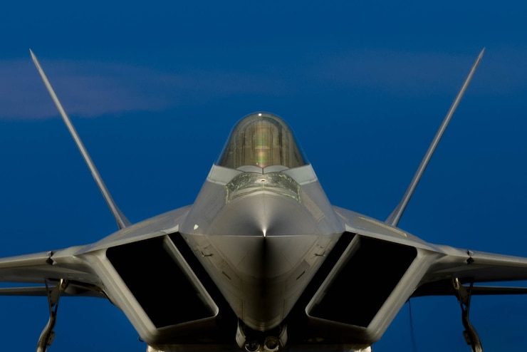 A U.S. Air Force F-22 Raptor pilot, assigned to the 1st Fighter Wing, completes pre-flight checks during night operations at Joint Base Langley-Eustis, Va., July 11, 2017. Night operations allow pilots to maximize combat readiness in the 1st FW's lines of effort and maintain night navigation proficiency. (U.S. Air Force photo/Staff Sgt. Carlin Leslie)
