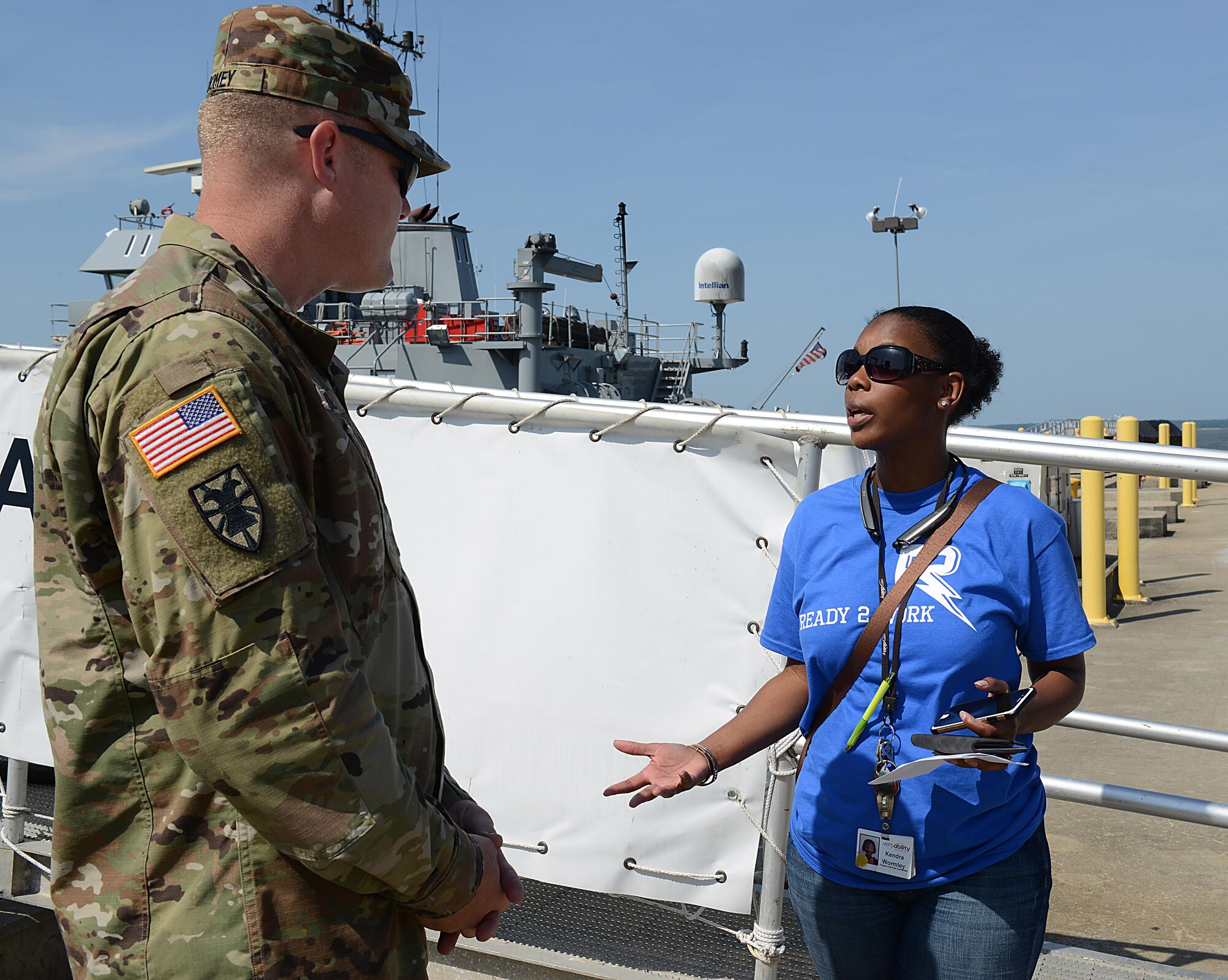 (From right) Kendra Wormley, Versability Resources senior operations manager, briefly explains the need for sign language interpreters to U.S. Army Chief Warrant Officer 2 Kevin Toomey, 7th Transportation Brigade (Expeditionary) U.S. Army Vessel Brandy Station vessel master, during a Ready 2 Work program visit to Joint Base Langley-Eustis, Va., July 14, 2017. Students in the program range from 15 to 21 years old and either face intellectual developmental disabilities, or are considered “at risk” by the Newport News school system. (U.S. Air Force photo/Staff Sgt. Teresa J. Cleveland)