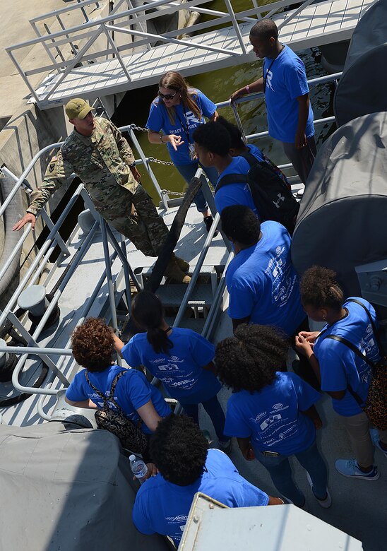 U.S. Army Sgt. 1st Class Marcus Corum, 7th Transportation Brigade (Expeditionary) U.S. Army Vessel Brandy Station first mate, provides information about the vessel to Ready 2 Work program students during a tour of Joint Base Langley-Eustis, Va., July 14, 2017. The students also visited the 128th Aviation Brigade and the U.S. Army Transportation Museum. (U.S. Air Force photo/Staff Sgt. Teresa J. Cleveland)