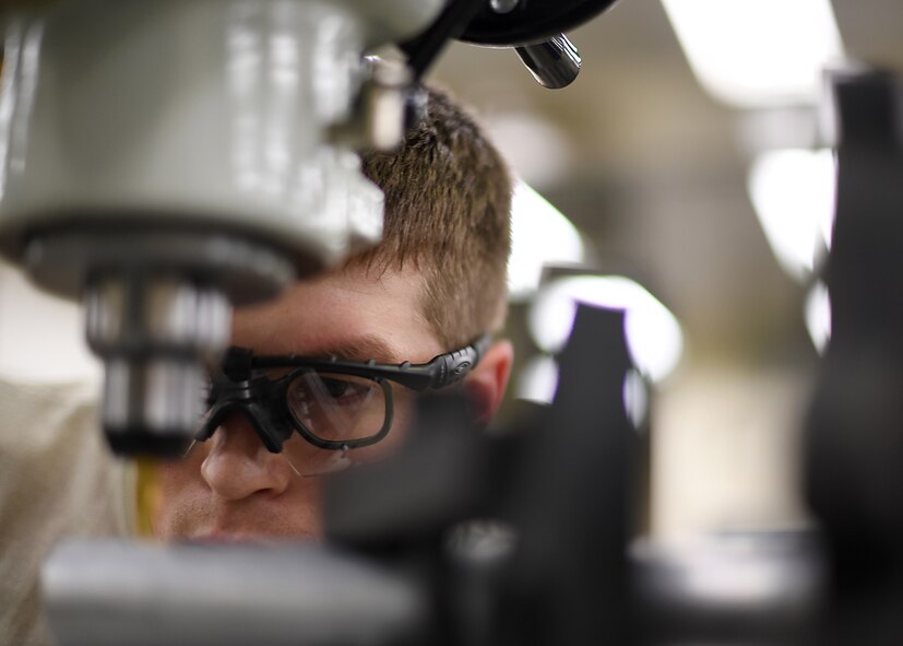 Staff Sgt. Brandt Perkins, 69th Maintenance Squadron aircraft metals technology craftsman, watches closely as he makes an incision on an aircraft part July 13, 2017, on Grand Forks Air Force Base, N.D. Perkins and other Airmen with the 69 MXS took their time to ensure the part for the RQ-4 Global Hawk was made perfectly because the part wasn’t available worldwide. (U.S. Air Force photo by Senior Airman Ryan Sparks)