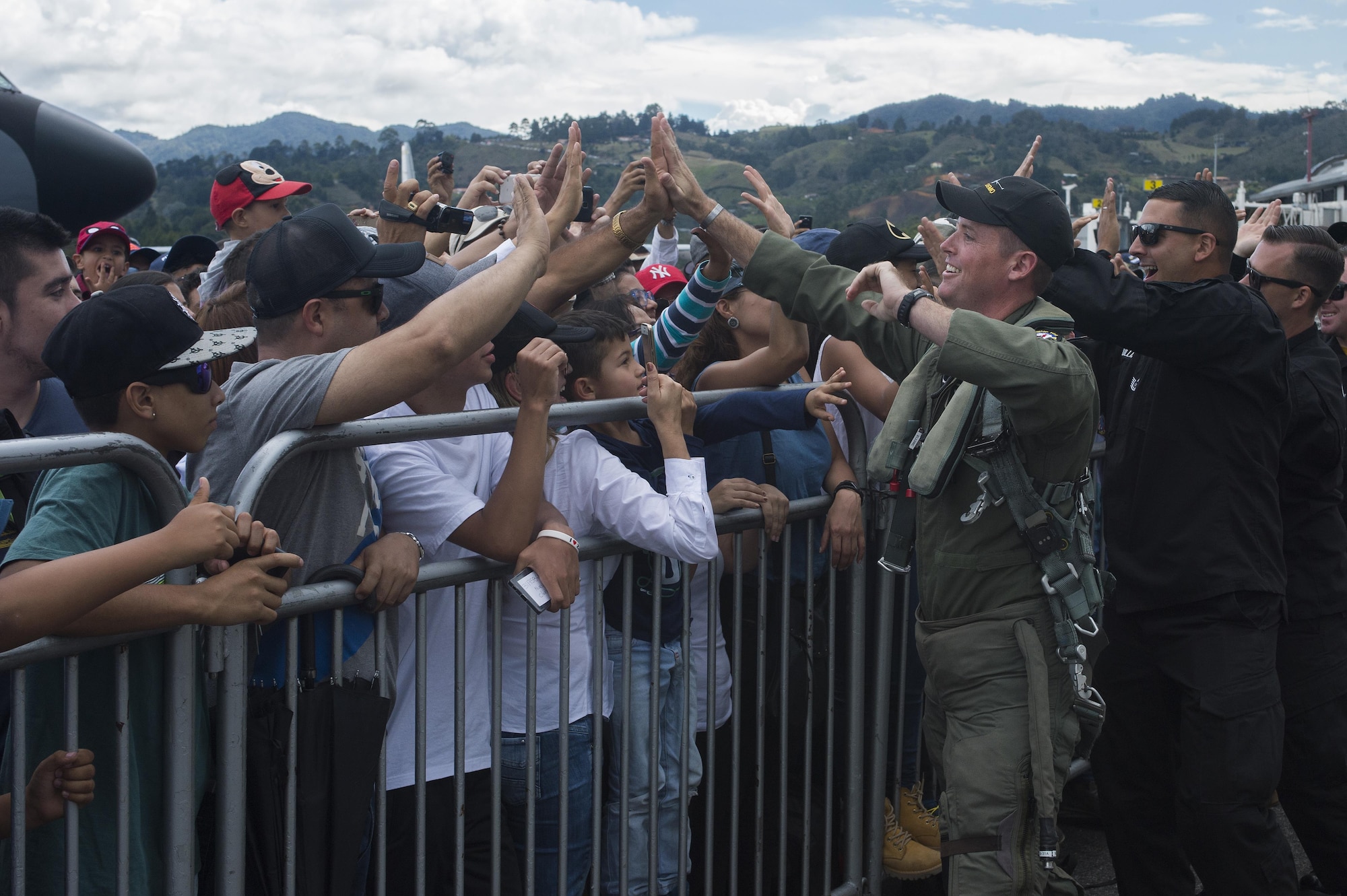 Members of the Air Combat Command F-16 Viper Demonstration Team greet attendees of the F-AIR COLOMBIA 2017 in Rionegro, Colombia, Juy 15, 2017. The demonstration team, along with Airmen from other units across the country, visited Colombia to showcase the capabilities of the U.S. Air Force while fostering a positive relationship between the U.S. and Colombia. (U.S. Air Force photo by Staff Sgt. Zade Vadnais)