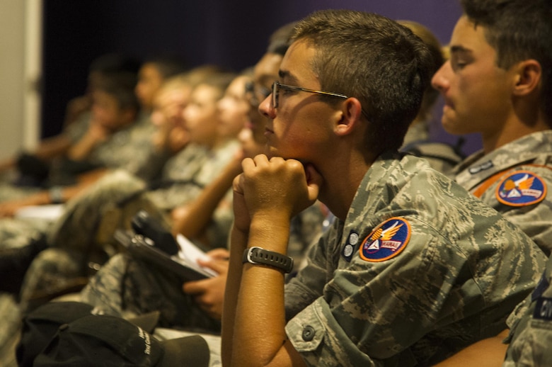 Cadets from the Civil Air Patrol listen to a safety briefing during their visit to the 15th Wing as part of their encampment, Joint Base Pearl Harbor-Hickam, Hawaii, July 14, 2017. Encampment is a week-long program, during which cadets are immersed into a modified Air Force basic training environment. Cadets learned the basics of military life with physically and mentally challenging activities. (U.S. Air Force photo by Tech. Sgt. Heather Redman)