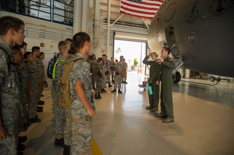 Maj. Christine Wintermote, 15th Operations Support Squadron assistant director of operations, and Capt. Nicholas Strobel, 535th Airlift Squadron C-17 pilot, brief cadets from the Civil Air Patrol on the capabilities of the C-17 Globemaster III during their visit to the 15th Wing as part of their encampment, Joint Base Pearl Harbor-Hickam, Hawaii, July 14, 2017. Encampment is a week-long program, during which cadets are immersed into a modified Air Force basic training environment. Cadets learned the basics of military life with physically and mentally challenging activities. (U.S. Air Force photo by Tech. Sgt. Heather Redman)