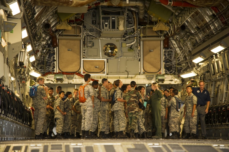 Cadets from the Civil Air Patrol tour a C-17 Globemaster III during their visit to the 15th Wing as part of their encampment, Joint Base Pearl Harbor-Hickam, Hawaii, July 14, 2017. Encampment is a week-long program, during which cadets are immersed into a modified Air Force basic training environment. Cadets learned the basics of military life with physically and mentally challenging activities. (U.S. Air Force photo by Tech. Sgt. Heather Redman)