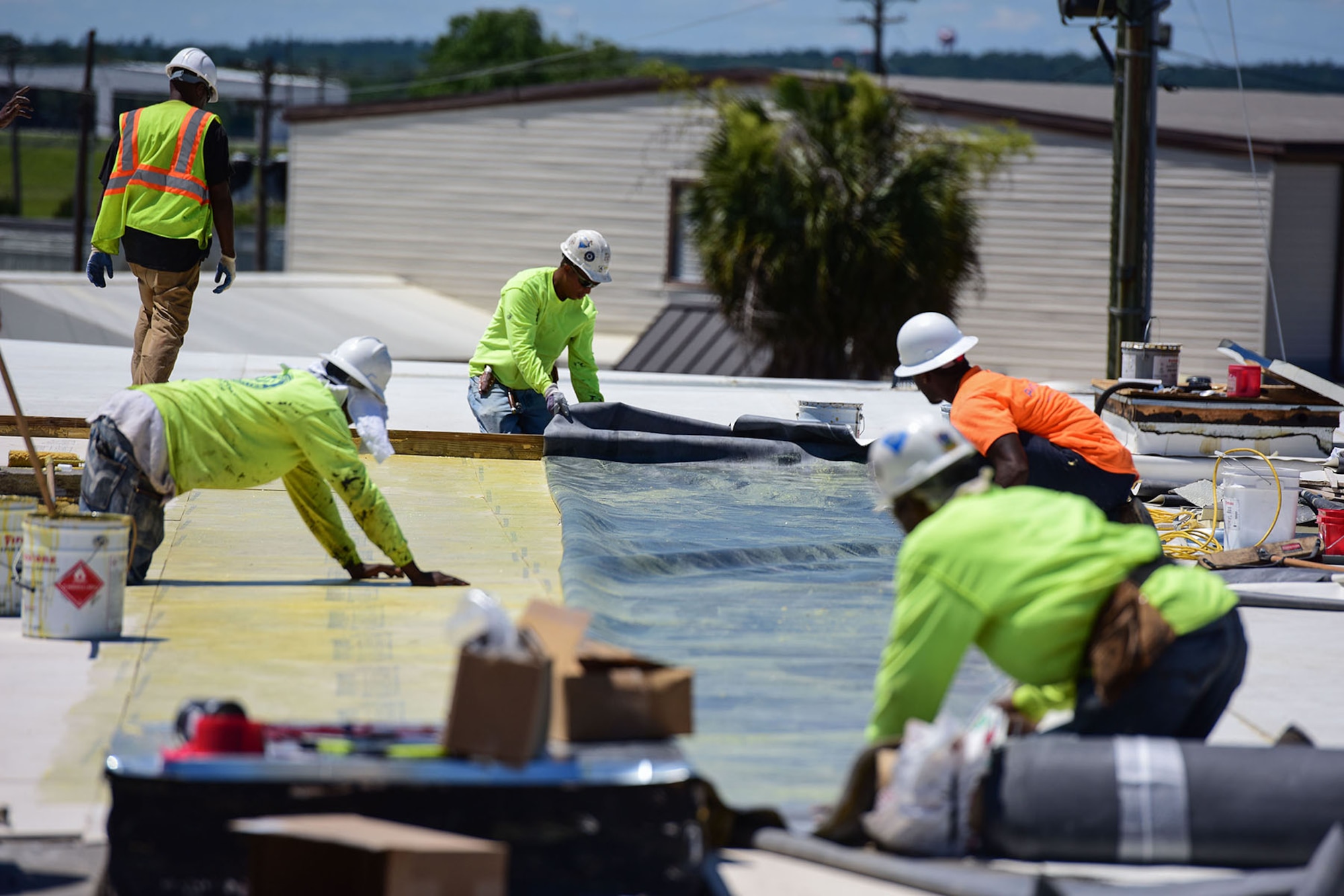 Civilian contractors work on renovation projects at various locations around McEntire Joint National Guard Base, S.C., June 8, 2017. Select buildings and runway sections are undergoing renovations designed and contracted by the 169th Civil Engineer Squadron which will aid training missions of Swamp Fox Airmen. (U.S. Air National Guard photo by Senior Airman Megan Floyd)