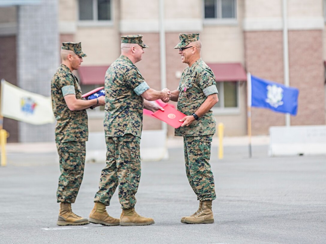 Sergeant Major Slattery retires from the U.S. Marine Corps after 30 years of faithful service and passes his duties and responsibilities as 3d Assault Amphibian Battalion to Sgt. Maj. Garcia on May 5, 2017, at Camp Pendleton, Calif.