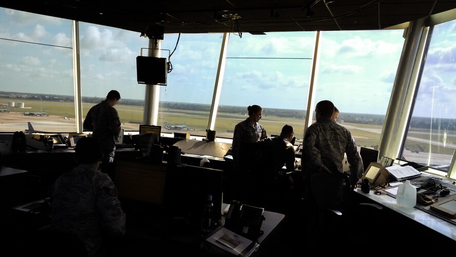Air traffic controllers with the 2nd Operations Squadron monitor aircraft at Barksdale Air Force Base, La., July 11, 2017. Monitoring the airspace is a vital component of mission effectiveness for both aircrew and Airmen on the ground. (U.S. Air Force Photo/ Nevardo Cayemitte)