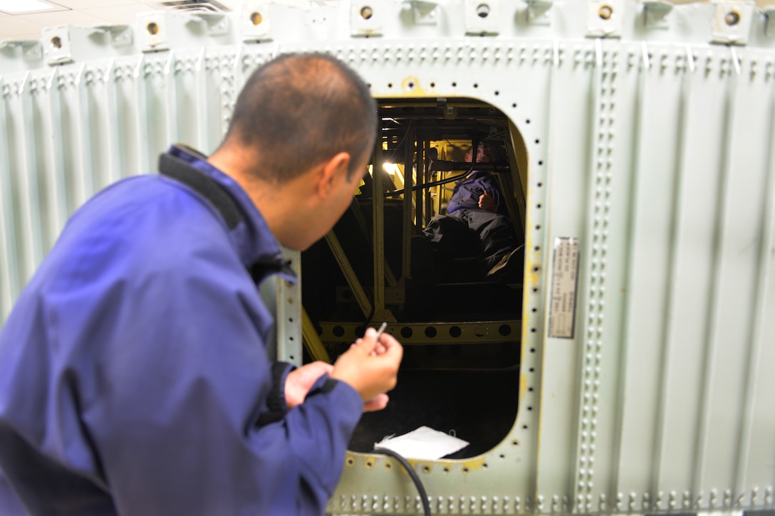Airman Victor Mendoza 361st Training Squadron aircraft fuel systems apprentice course student learns to diagnose and repair fuel system malfunctions at Sheppard Air Force Base, Texas, July 11, 2017. He supervises are other students remove and replace the No. 2 dump pump in a C-130 wing. (U.S. Air Force photo/Liz H. Colunga)
