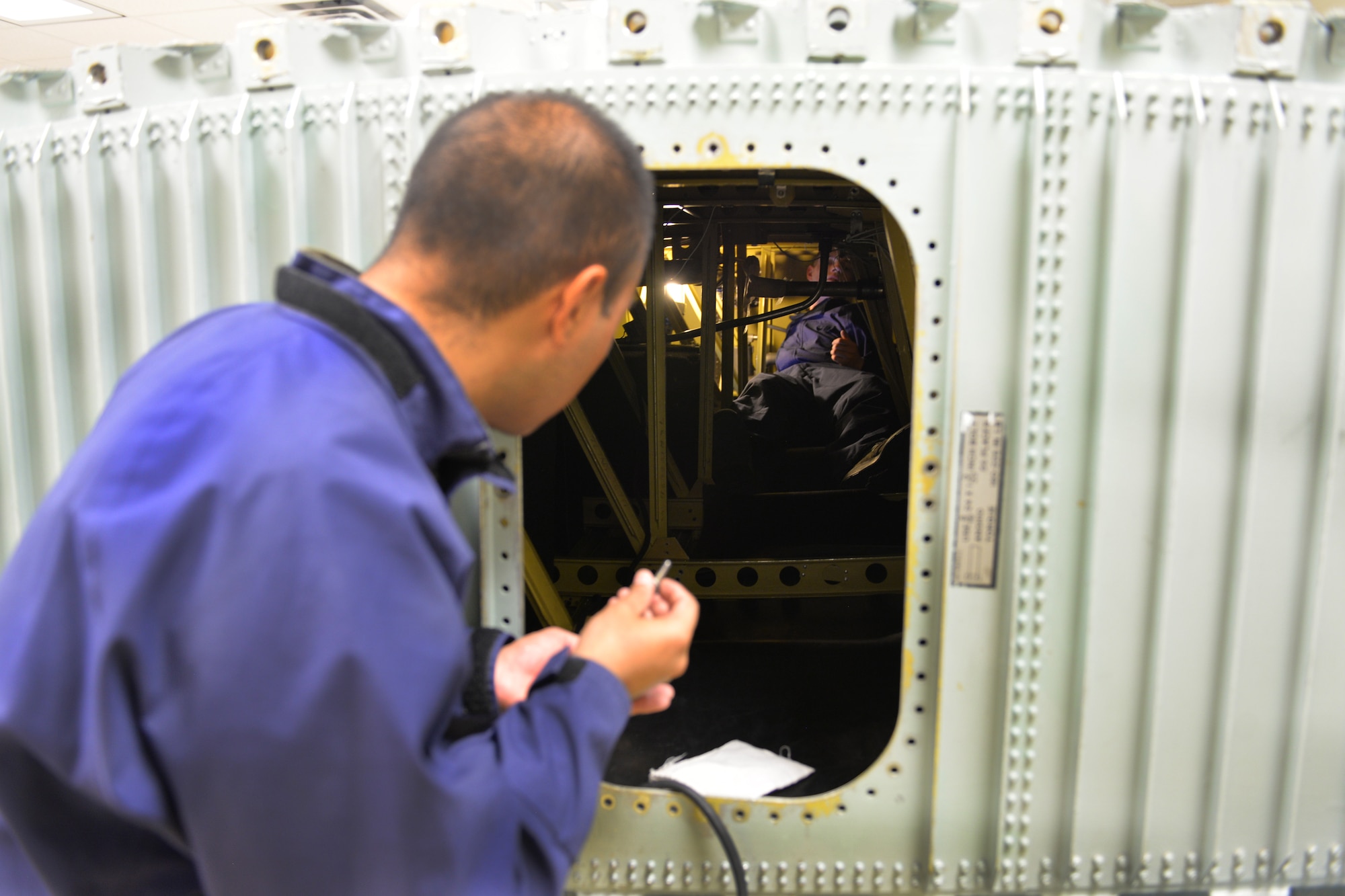 Airman Victor Mendoza 361st Training Squadron aircraft fuel systems apprentice course student learns to diagnose and repair fuel system malfunctions at Sheppard Air Force Base, Texas, July 11, 2017. He supervises are other students remove and replace the No. 2 dump pump in a C-130 wing. (U.S. Air Force photo/Liz H. Colunga)