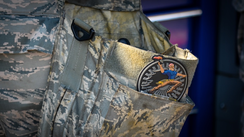 A 20th Aircraft Maintenance Unit patch is affixed to an Airman’s tool belt during a weapons load competition at Barksdale Air Force Base, La., July 7, 2017. The quarterly competition also provided additional training for crew members who may not have as much experience or familiarity with a certain weapon, and all crew members must continually train on each weapon to maintain their certification. (U.S Air Force photo/Staff Sgt. Benjamin Raughton)