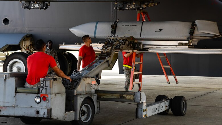 Members of the 96th Aircraft Maintenance Unit upload a joint air-to-surface standoff missle, or JASSM, to a MAU-12, which will hold the munition during a weapons load competition at Barksdale Air Force Base, La., July 7, 2017. The 96th AMU won the competition against the 20th with an upload time of 23 minutes, 30 seconds. (U.S Air Force photo/Staff Sgt. Benjamin Raughton)