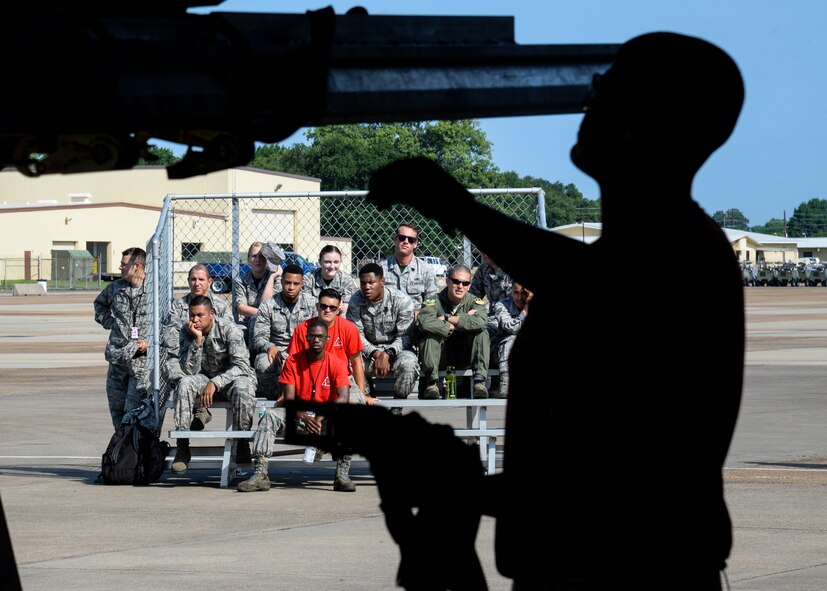 Airman 1st Class Anthony Rhodes, 96th Aircraft Maintenance Unit weapons load crew member, removes straps to remove a container which holds a munition during a quarterly weapons load competition at Barksdale Air Force Base, La., July 7, 2017. The friendly competition, which began early in the morning to avoid the searing Louisiana sun, is designed to bring the weapons community together, boost morale and increase training. (U.S Air Force photo/Staff Sgt. Benjamin Raughton)