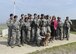 Christina Olds, daughter of Brig. Gen. Robin Olds, stands with members of the 8th Security Forces Squadron during a tour at Kunsan Air Base, Republic of Korea, July 14, 2017. Olds visited Kunsan to celebrate her father’s 95th birthday and share his legacy with the Wolf Pack. (U.S. Air Force photo by Senior Airman Michael Hunsaker/Released)