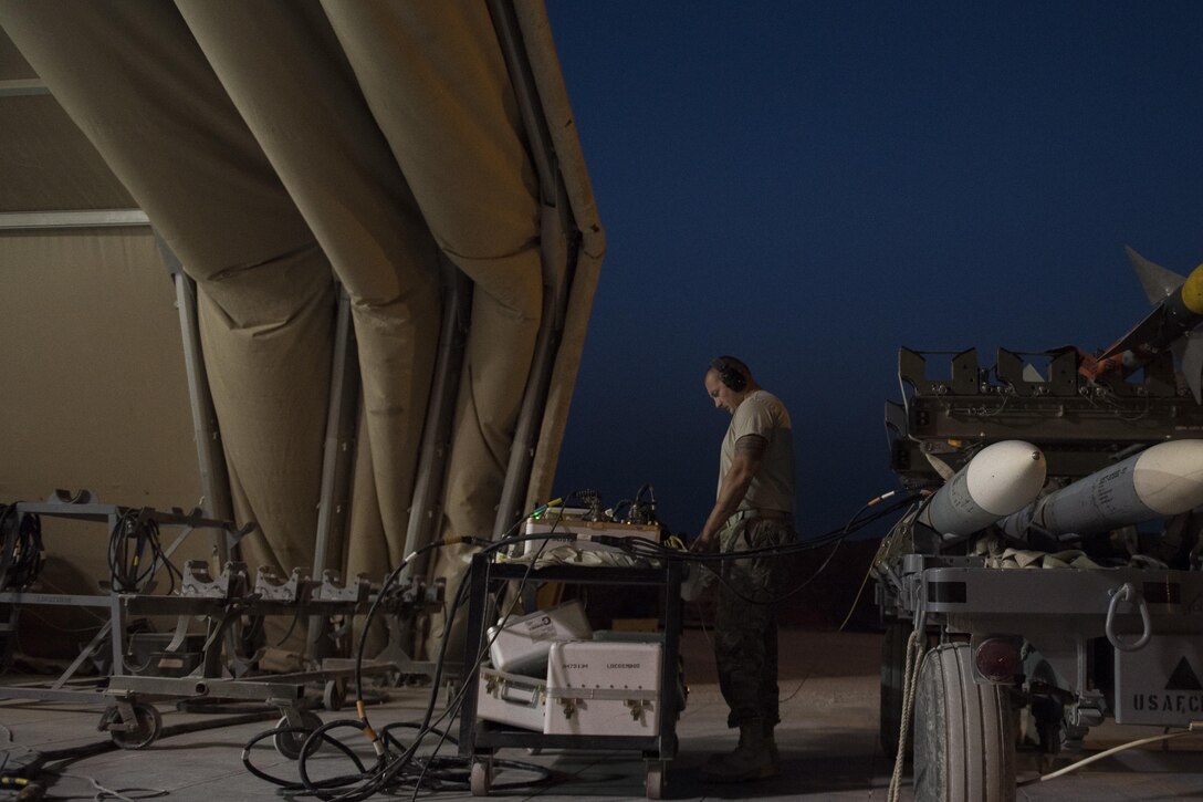 Airmen from the 332nd Expeditionary Maintenance Squadron build GBU-38s, July 12, 2017, in Southwest Asia. The squadron builds and maintains a variety of munitions to arm F-15E Strike Eagles and MQ-9 Reapers in support of Operation Inherent Resolve. (U.S. Air Force photo/Senior Airman Damon Kasberg)