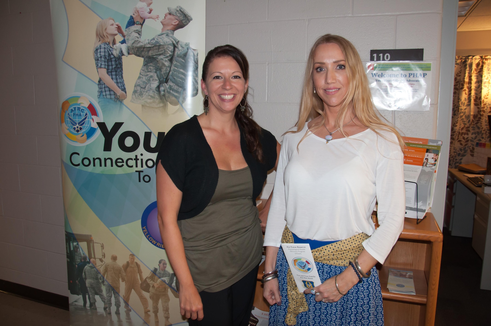 Brittney Snider, Psychological Health Advocacy Program Registered Nurse Case Facilitator (left), and Pamela Boyd, PHAP Outreach Specialist, assist reservists and families in the North region, from Minnesota to Missouri across to Virginia and up to Maine, with dealing with life’s stressors. Snider and Boyd have extensive military backgrounds and are both currently reservists themselves. 
(U.S. Air Force photo/John Harrington)
