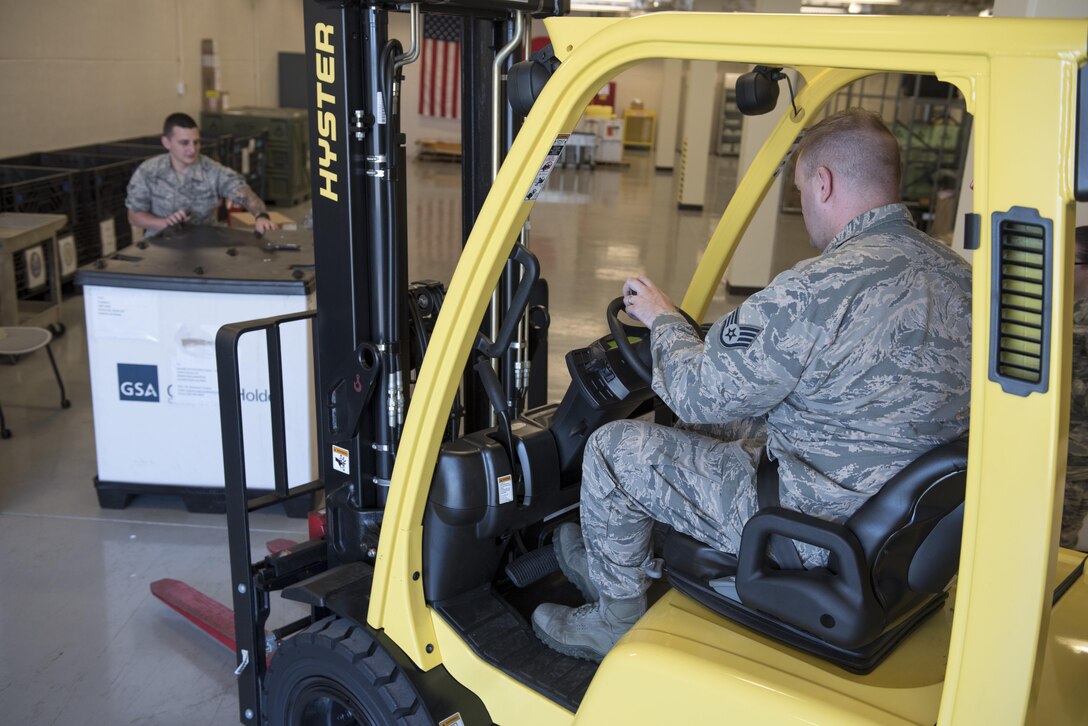 U.S. Air Force U.S. Air Force Airman 1st Class Brett Silverman and Staff Sgt. Jared Bland, 18th Medical Support Squadron medical logistics technicians, load a pallet of supplies onto a forklift during a medical material distribution exercise July 13, 2017, at Kadena Air Base, Japan. During the exercise, 18th MDSS Airmen were challenged to meet the demands of their regular customers for real-world operations and respond to simulated crises throughout the Pacific. (U.S. Air Force photo by Senior Airman John Linzmeier)