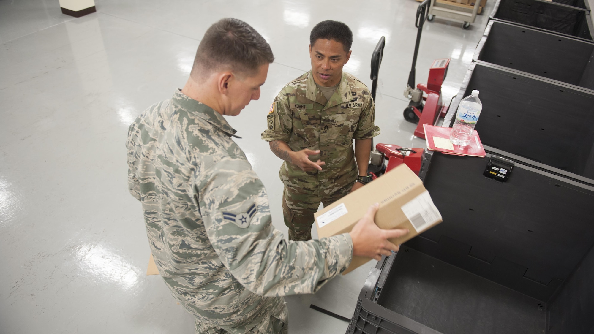 U.S. Air Force Airman 1st Class Rock Remillard, 18th Medical Support Squadron medical logistics technician, and U.S. Army Staff Sgt. Don Kosht, 1-1 Special Forces Group medical logistics NCO, check the supplies for a mock shipment during  a Theater Lead Agent for Medical Materiel – Pacific (TLAMM-P) joint exercise July 13, 2017, at Kadena Air Base, Japan. The TLAMM-P team oversees resupply of the medical needs for U.S. and allied forces in the Pacific region. (U.S. Air Force photo/ Airman 1st Class Greg Erwin)