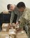 U.S. Air Force Airman 1st Class Rock Remillard, 18th Medical Support Squadron medical logistics technician, and U.S. Army Staff Sgt. Don Kosht, 1-1 Special Forces Group medical logistics NCO, inspect materials during a Theater Lead Agent for Medical Materiel – Pacific (TLAMM-P) joint exercise July 13, 2017, at Kadena Air Base, Japan. TLAMM-P is crucial to humanitarian efforts in getting needed medical supplies to units in the field. (U.S. Air Force photo/ Airman 1st Class Greg Erwin)