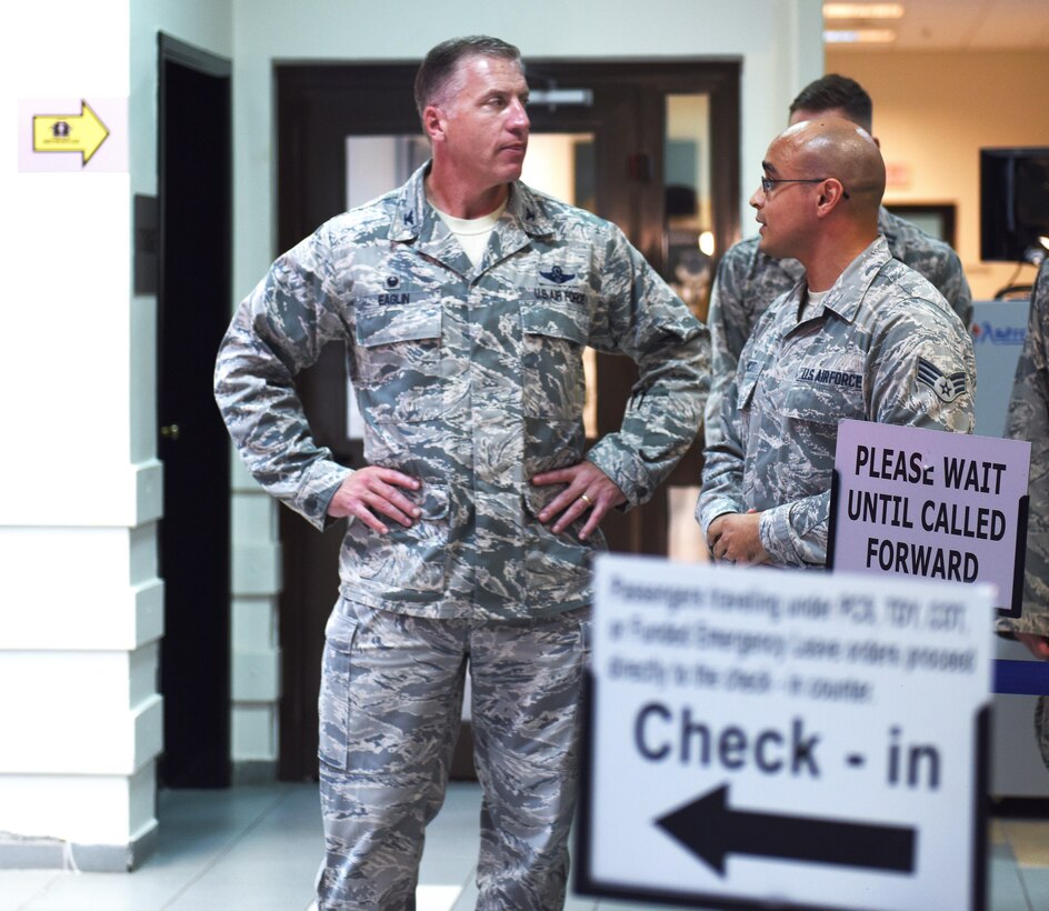 U.S. Air Force Senior Airman Linden Hunnicutt, passenger service agent, briefs Col. David Eaglin, 39th Air Base wing commander, on the passenger travel services that are offered at the terminal July 17, 2017 at Incirlik Air Base, Turkey. U.S. military members and their families are provided with travel via Space-Available (Space-A) Capability. (U.S. Air Force photo by Senior Airman Jasmonet D. Jackson)