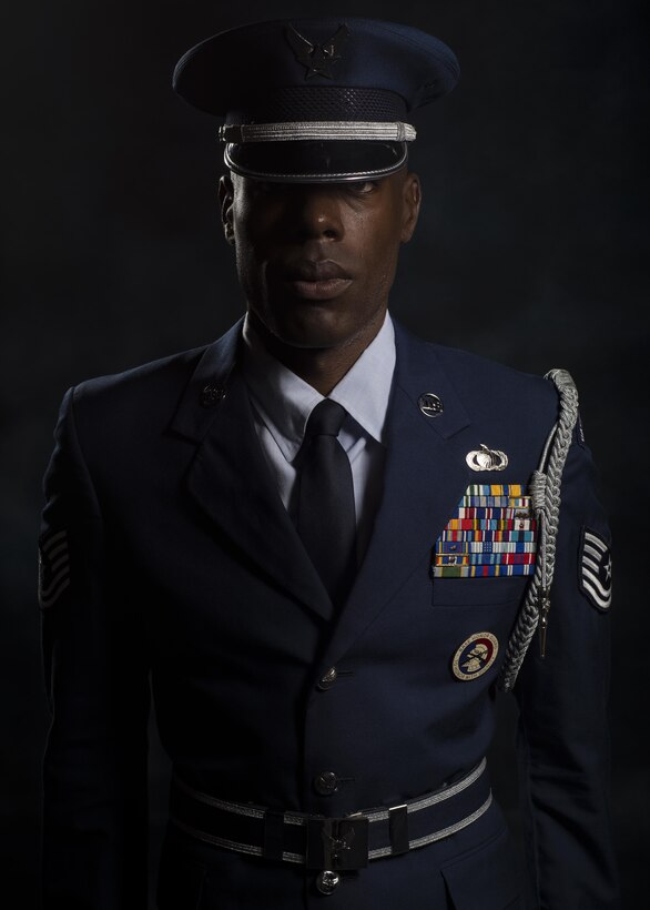 Tech. Sgt. Martin Wallace, 31st Fighter Wing Honor Guard lead instructor, poses for a photo July 13, 2017, at Aviano Air Base, Italy. Wallace currently leads more than 30 Airmen working to become fully qualified honor guardsmen. (U.S. Air Force photo by Senior Airman Cory W. Bush)