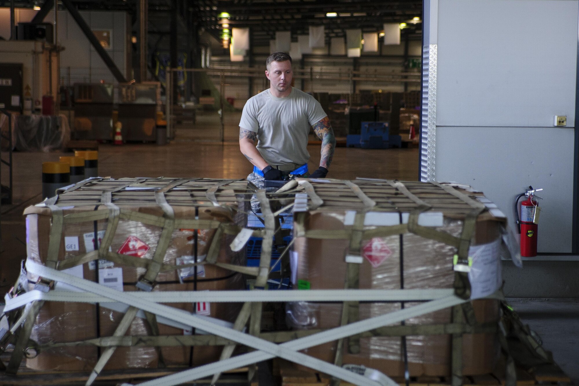 Tech. Sgt. William Anderson, an Airman from the 81st Aerial Port Squadron, Joint Base Charleston, conducts off-station annual training in the special handling section at Ramstein Air Base, Germany, July 19, 2017. Anderson’s use of this ICEM pallet mover, nicknamed “Blue Goose,” allows him to move large pallets of cargo with ease.  (U.S. Air Force photo by Senior Airman Jonathan Lane)