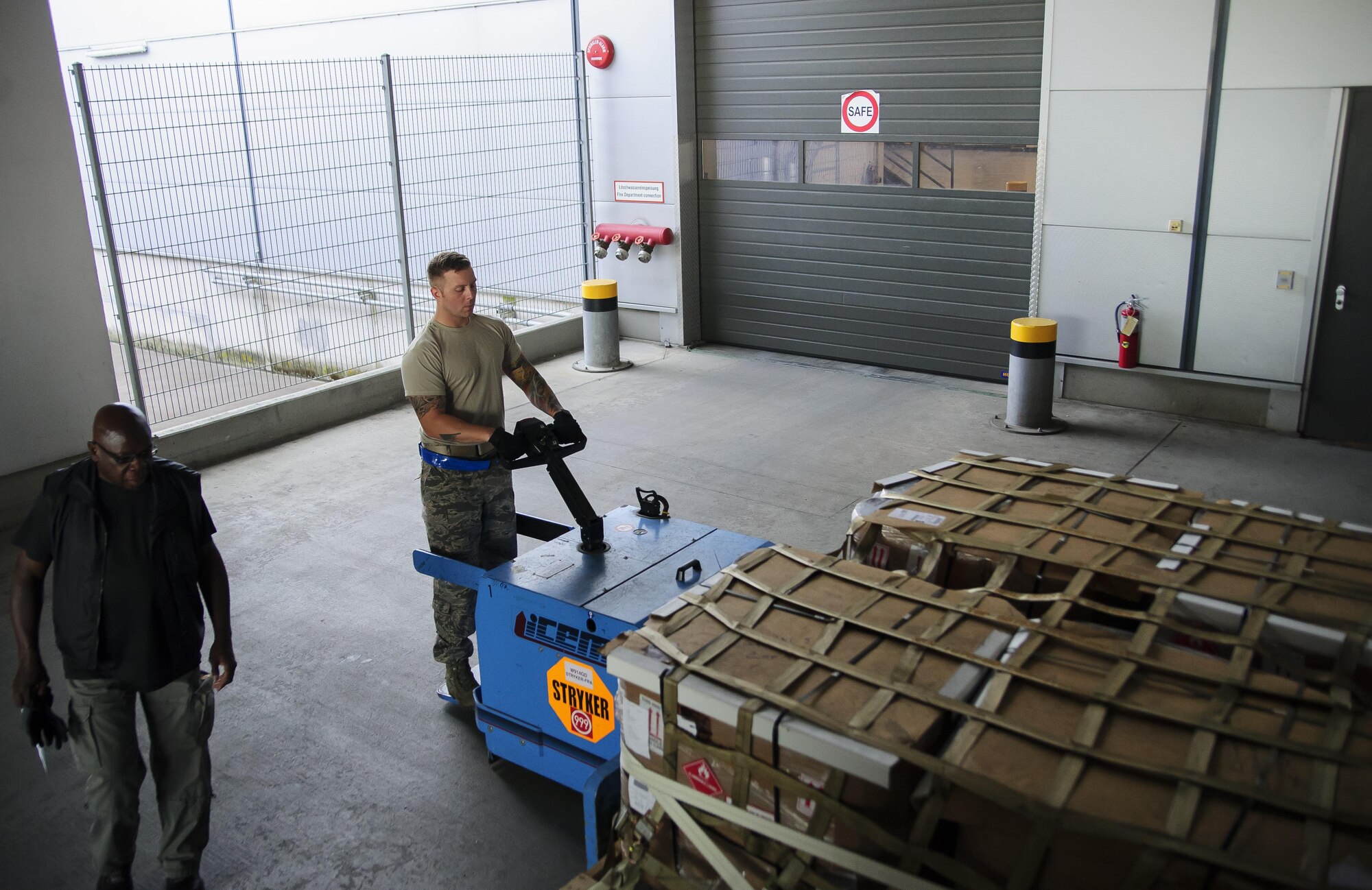 Tech. Sgt. William Anderson, an Airman from the 81st Aerial Port Squadron, Joint Base Charleston, conducts off-station annual training in the special handling section at Ramstein Air Base, Germany, July 19, 2017. Anderson’s use of this ICEM pallet mover, nicknamed “Blue Goose,” allows him to move large pallets of cargo with ease.  (U.S. Air Force photo by Senior Airman Jonathan Lane)