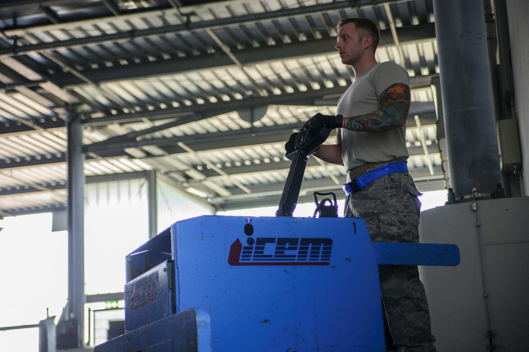 Tech. Sgt. William Anderson, an Airman from the 81st Aerial Port Squadron, Joint Base Charleston, loads a pallet of hazardous cargo on a weigh-station in the special handling section at Ramstein Air Base, Germany, July 19, 2017.  Anderson, along with fellow Airmen from the 81st APS, completed annual tour training requirements while in Germany.
  (U.S. Air Force photo by Senior Airman Jonathan Lane)