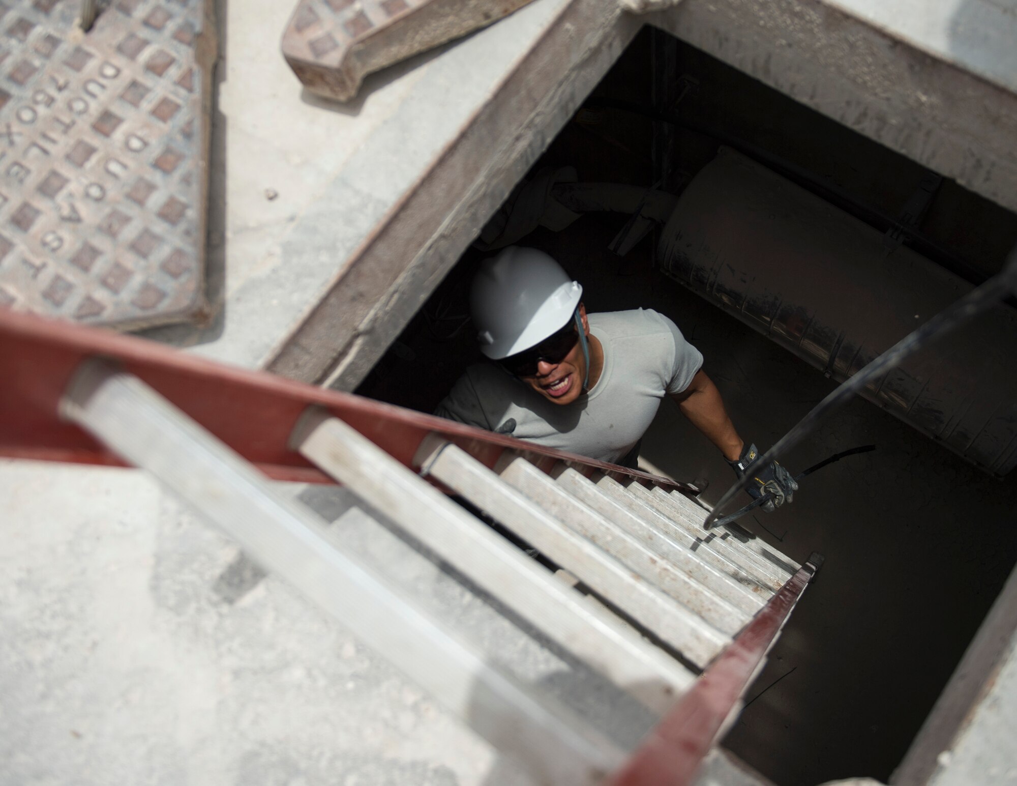 U.S. Air Force Staff Sgt. Aaron Ramelb, a cable and antenna system specialist with the 379th Expeditionary Communication Squadron, asks for more fiber optic cable at Al Udeid Air Base, Qatar, July 14, 2017. Ramelb is part of a team of airmen that is responsible for installing, sustaining, and repairing miles of copper and fiber optics cables at Al Udeid Air Base. (U.S. Air Force photo by Tech. Sgt. Amy M. Lovgren)