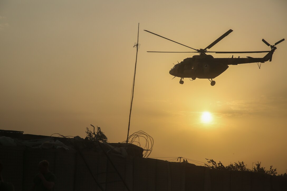An Afghan MI-17 helicopter flies over Camp Shorserack, Afghanistan to deliver supplies to Afghan National Army 215th Corps soldiers July 15, 2017. Elements of the Afghan National Defense and Security Forces, including the 215th Corps and 505th Zone National Police, cleared the Nawa district center of insurgents during Operation Maiwand Four, improving security and stability while also helping to establish governance in the area. (U.S. Marine Corps photo by Sgt. Lucas Hopkins)