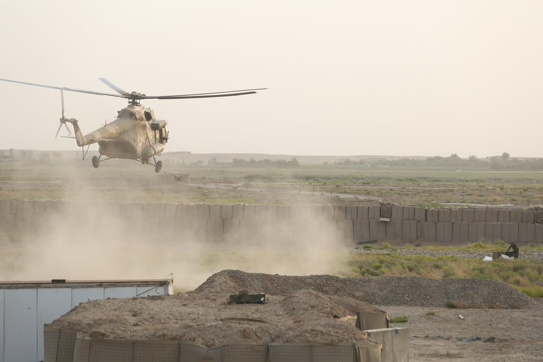 An Afghan MI-17 helicopter lands at Camp Shorserack, Afghanistan to deliver supplies to Afghan National Army soldiers with 215th Corps during Operation Maiwand Four July 15, 2017. U.S. Marine advisors with Task Force Southwest assisted their 215th Corps and 505th Zone National Police counterparts throughout the operation, in which elements of the Afghan National Defense and Security Forces successfully cleared the Nawa district center of enemy presence. The Task Force will continue to provide advisory assets to ANDSF as they improve the security posture and establish governance in Nawa. (U.S. Marine Corps photo by Sgt. Lucas Hopkins)