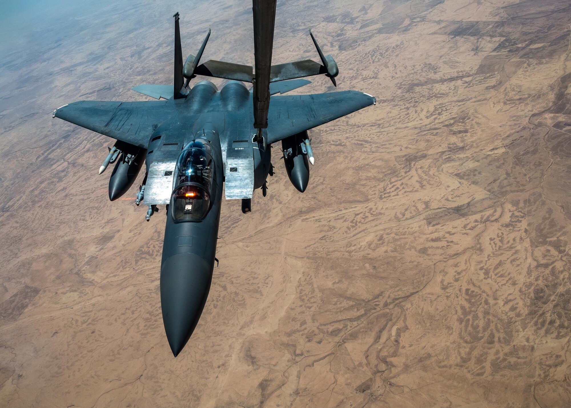 An F-15E Strike Eagle receives fuel from a KC-10 Extender with the 908th Expeditionary Air Refueling Squadron July 19, 2017, over an undisclosed location in southwest Asia. Although the KC-10's primary mission is aerial refueling, it can combine the tasks of tanker and cargo aircraft by refueling fighters and simultaneously carry the fighter support personnel and equipment on overseas deployments. (U.S. Air Force photo by Senior Airman Preston Webb)