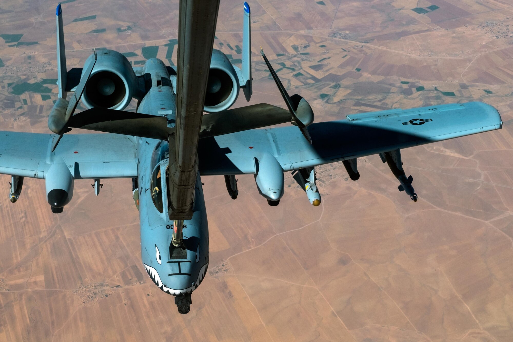 An A-10 Thunderbolt II receives fuel from a KC-10 Extender with the 908th Expeditionary Air Refueling Squadron July 19, 2017, over an undisclosed location in southwest Asia. The A-10can employ a variety of conventional munitions and the GAU-8/A 30mm cannon, capable of firing 3,900 rounds per minute to defeat a wide variety of targets including tanks. (U.S. Air Force photo by Senior Airman Preston Webb)