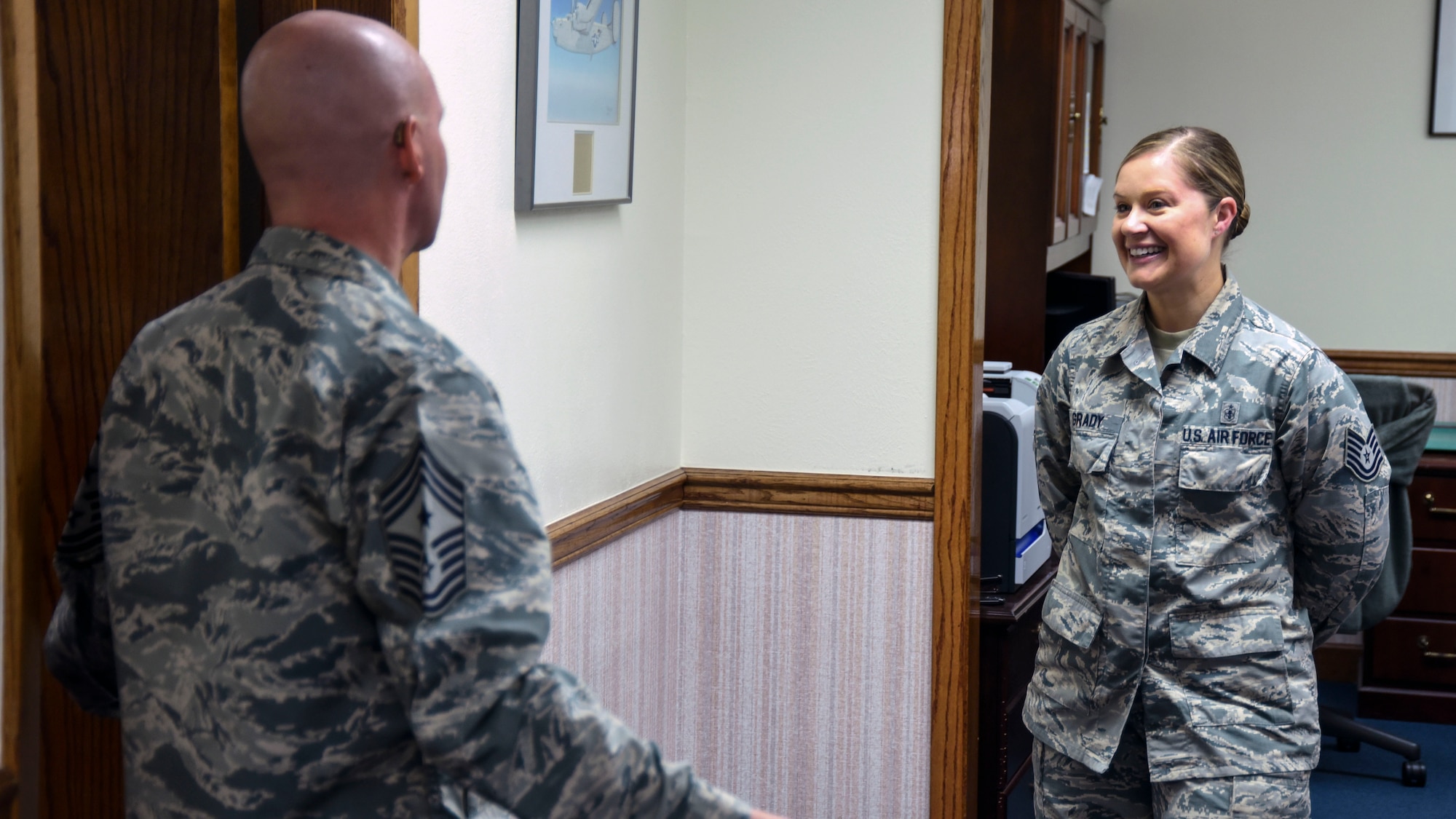 Chief Master Sergeant Thomas F. Good, Twentieth Air Force Command Chief, speaks with Tech. Sgt. Kate Grady, 377th Air Base Wing junior executive officer, at Kirtland Air Force Base, July 18. Grady explained her role in the wing front office, as well as her previous job as a bioenvironmental technician. (U.S. Air Force Photo/Senior Airman Chandler Baker) 